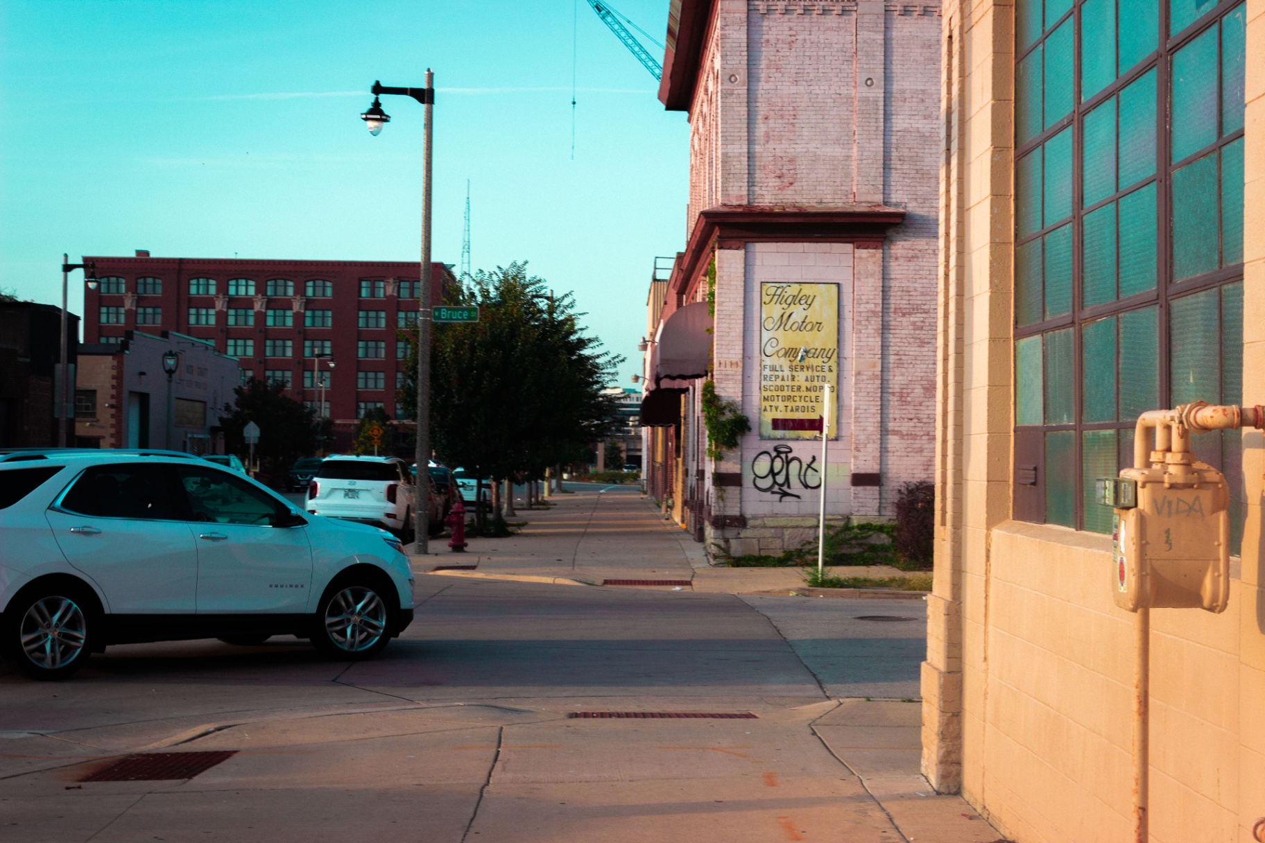 Ghost sign for Higley Motor Company on a Walker's Point brick facade