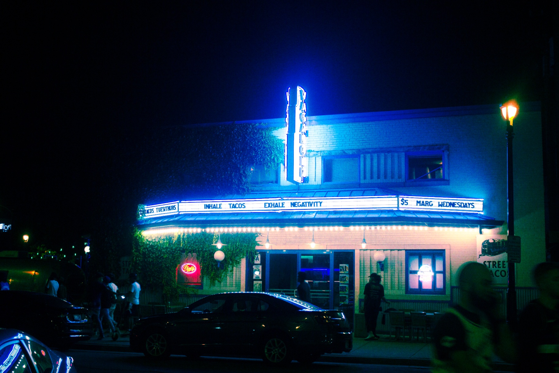 Neon marquee on a Milwaukee bar at night