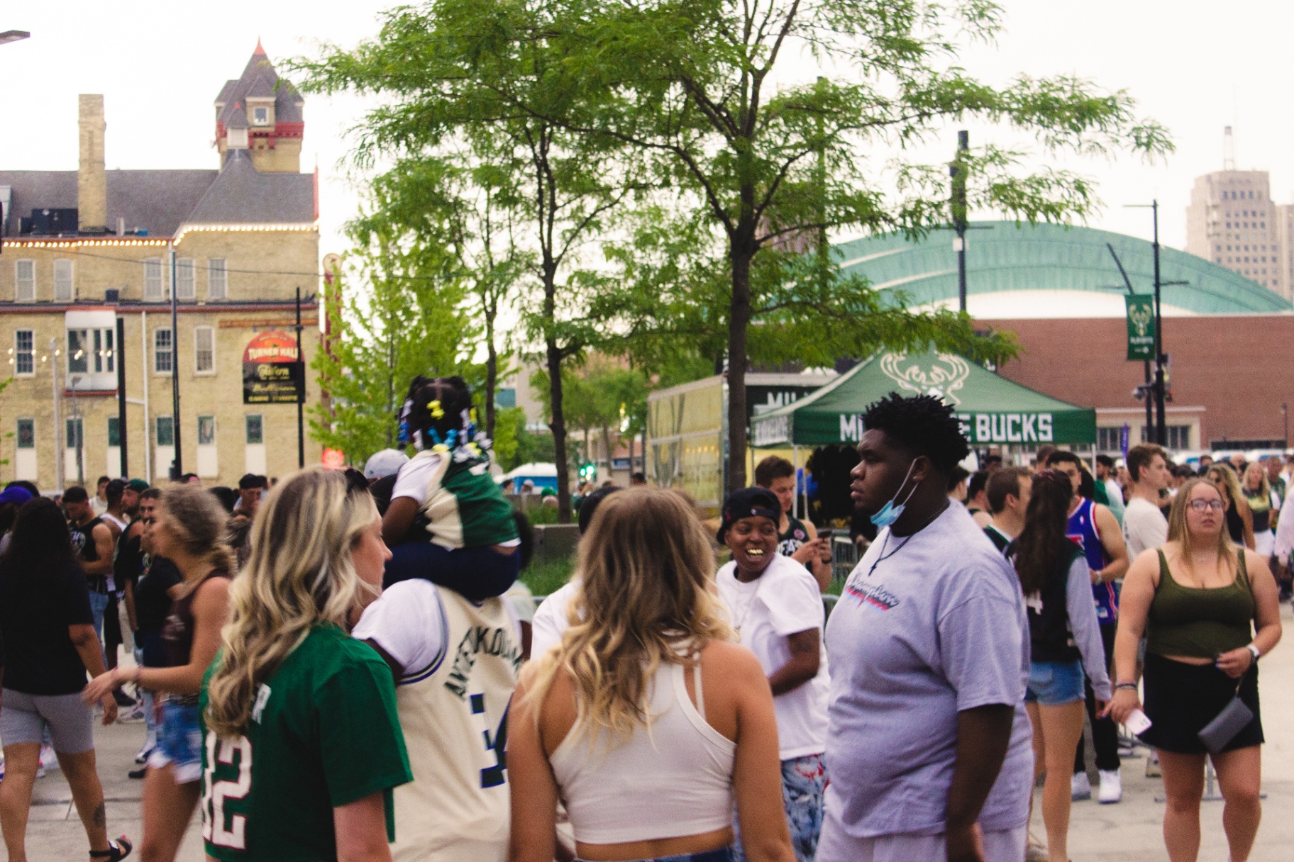 Wide shot of Fiserv Forum plaza with Bucks tent