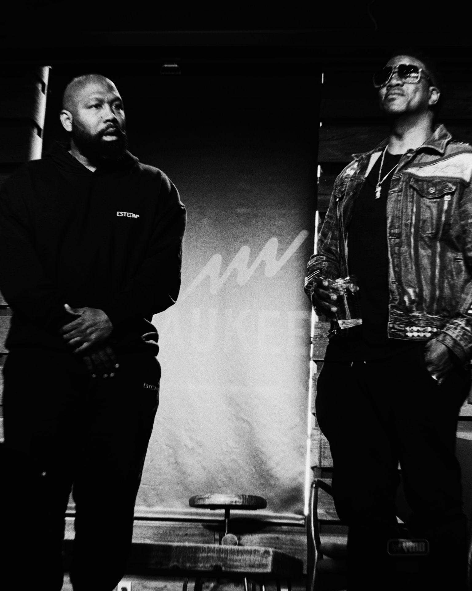 Two speakers on stage at a community talk