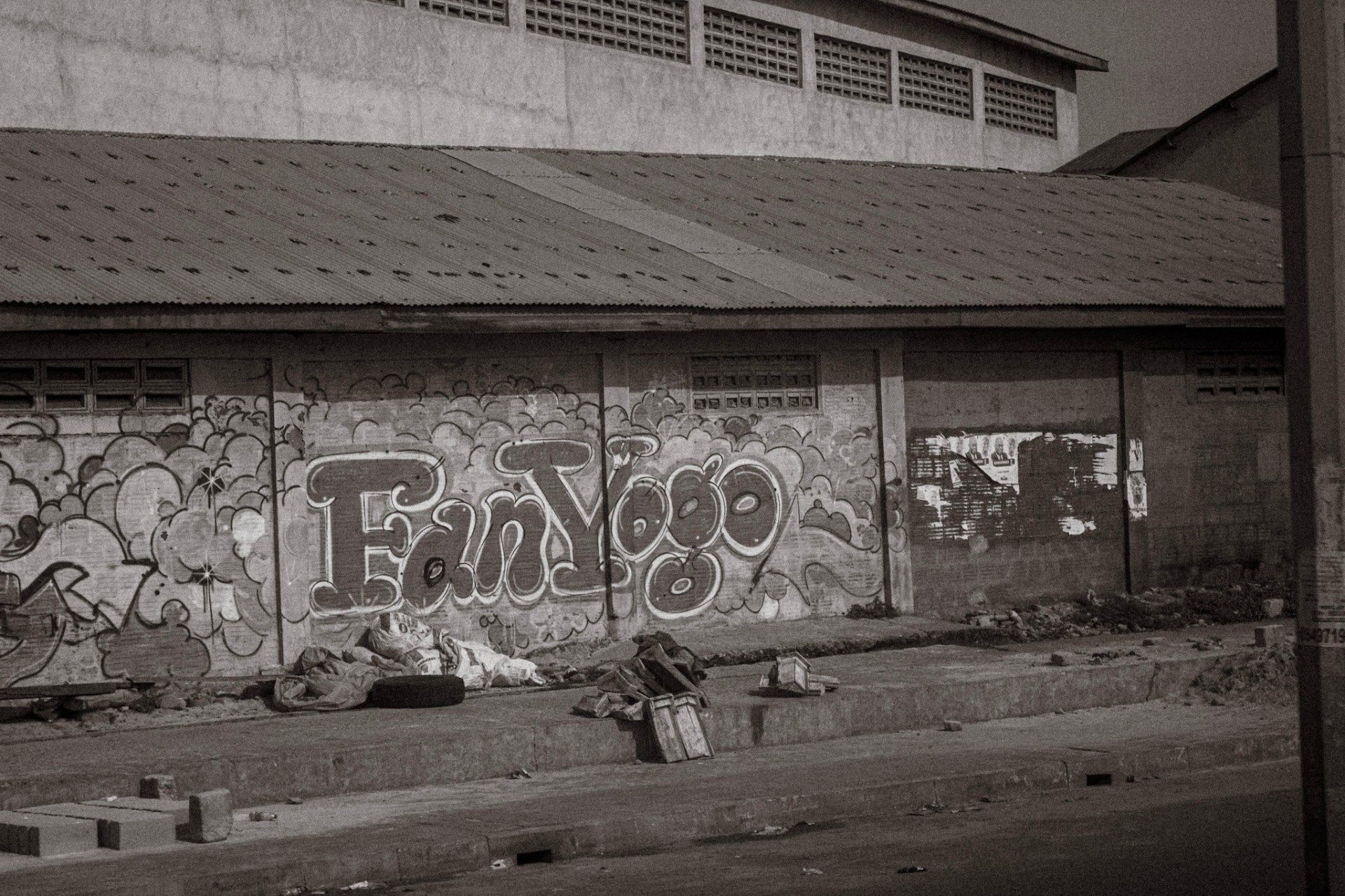 Fan Yogo bubble-letter graffiti on a warehouse wall