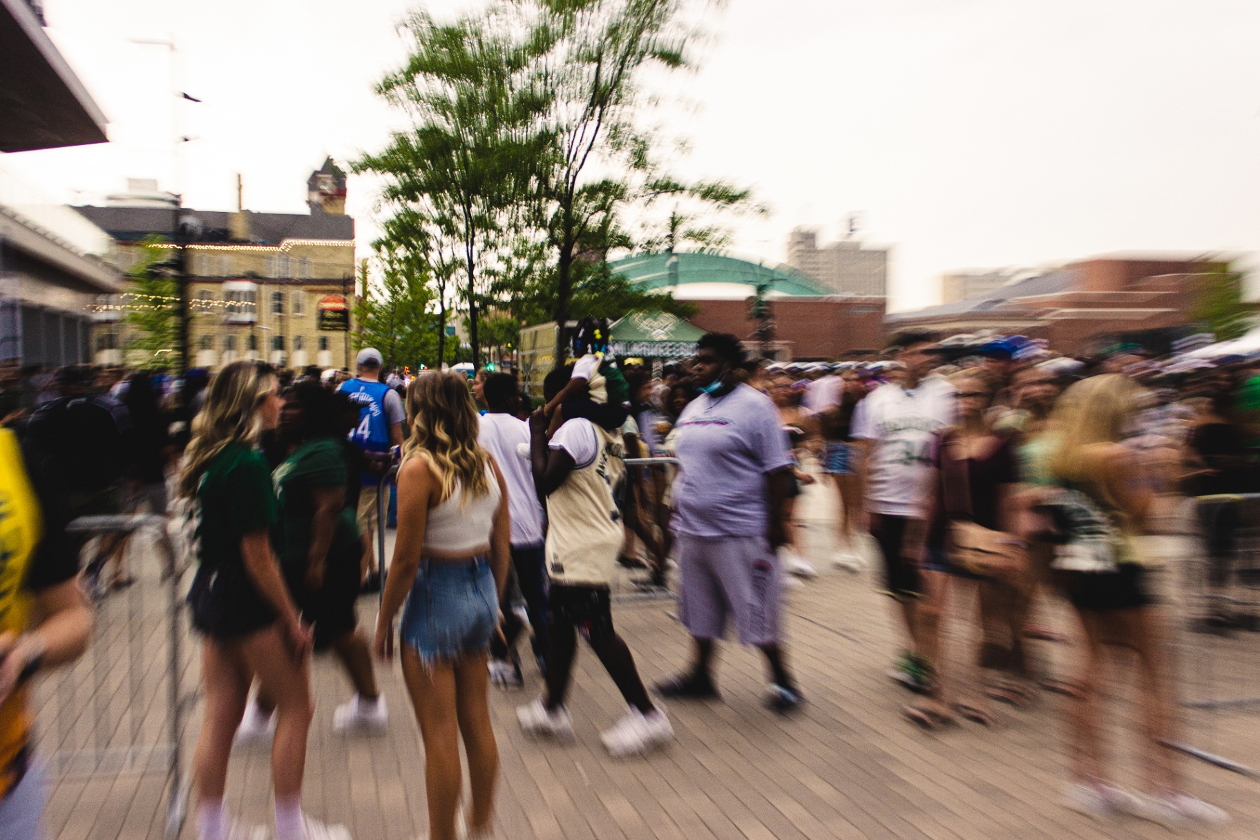 Motion blur of fans pouring into Deer District