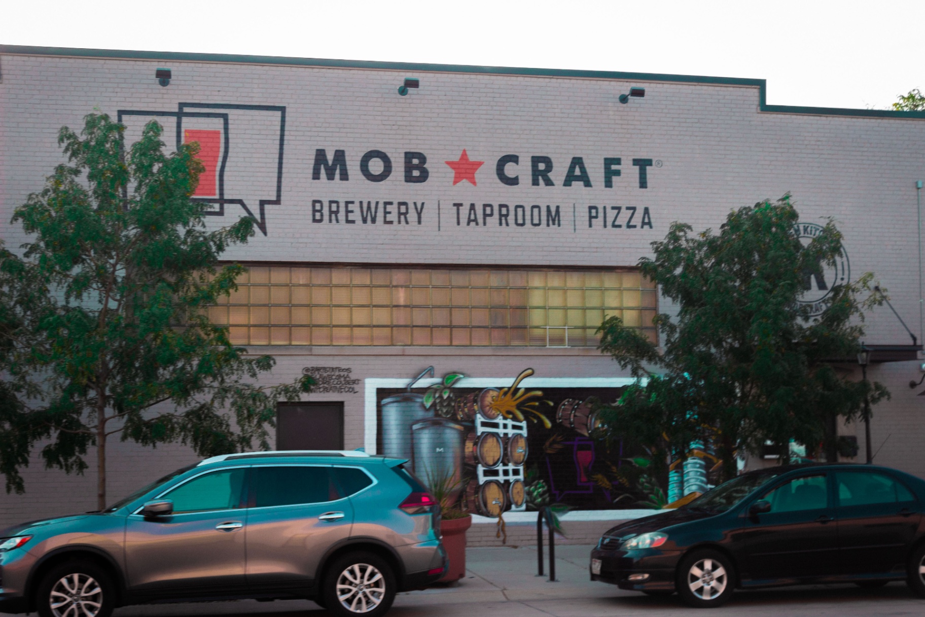 MobCraft Brewery brewery taproom pizza signage and mural