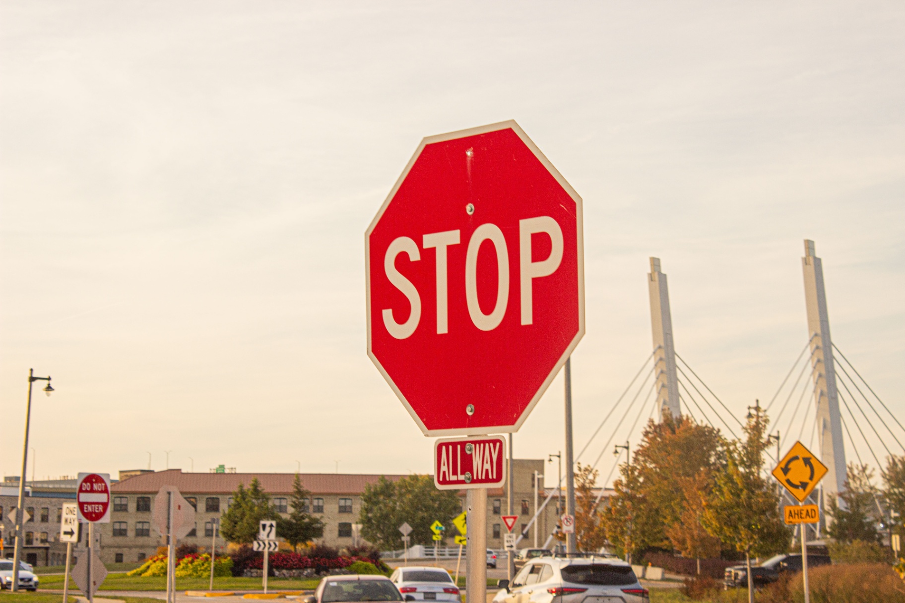 Stop sign framed against the cables of the 6th Street Bridge