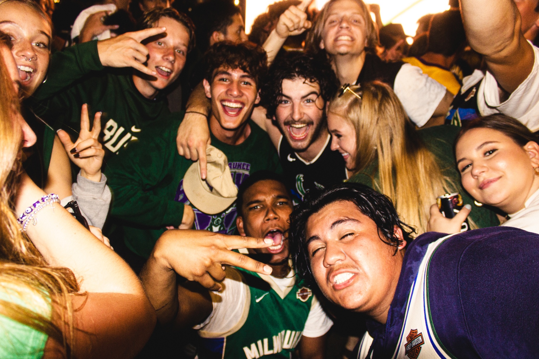 Group of fans celebrating in Bucks jerseys